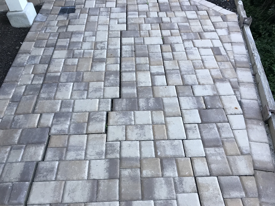 Before: Separation and settlement of the pavers